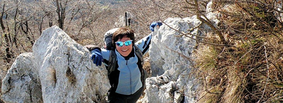 ExperiencePlus! tour leader Michela Bresciani climbing in the mountains above Lake Garda