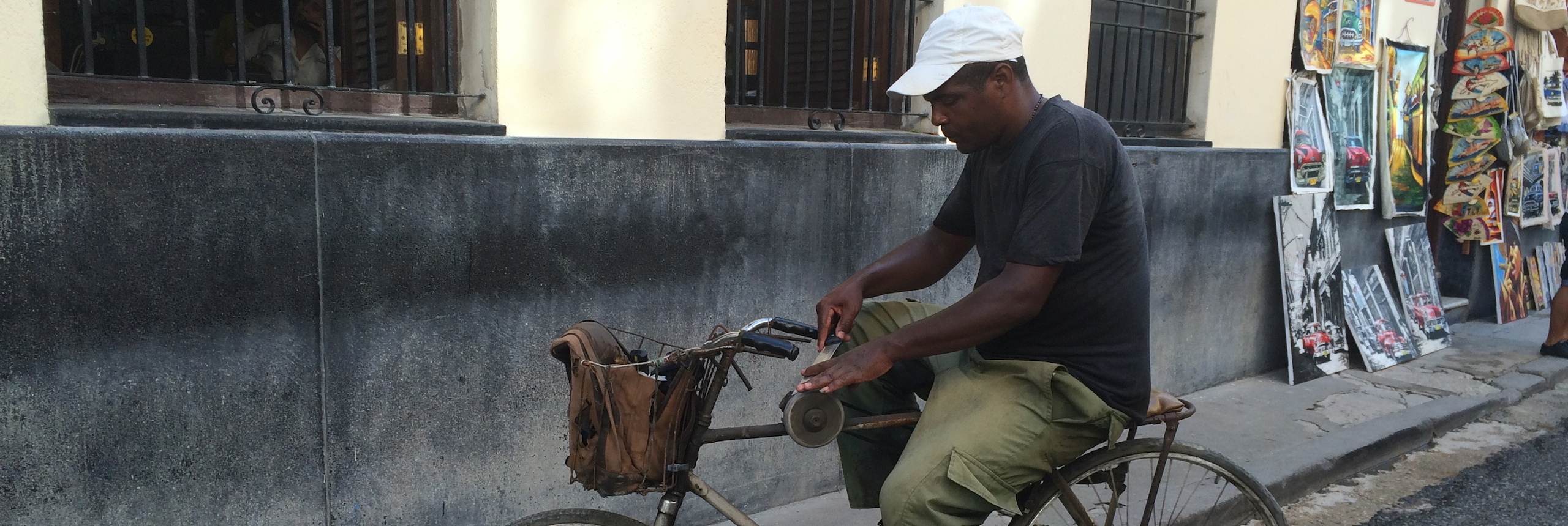 Sharpening knives - what you might see when you take a guided bike tour in Cuba