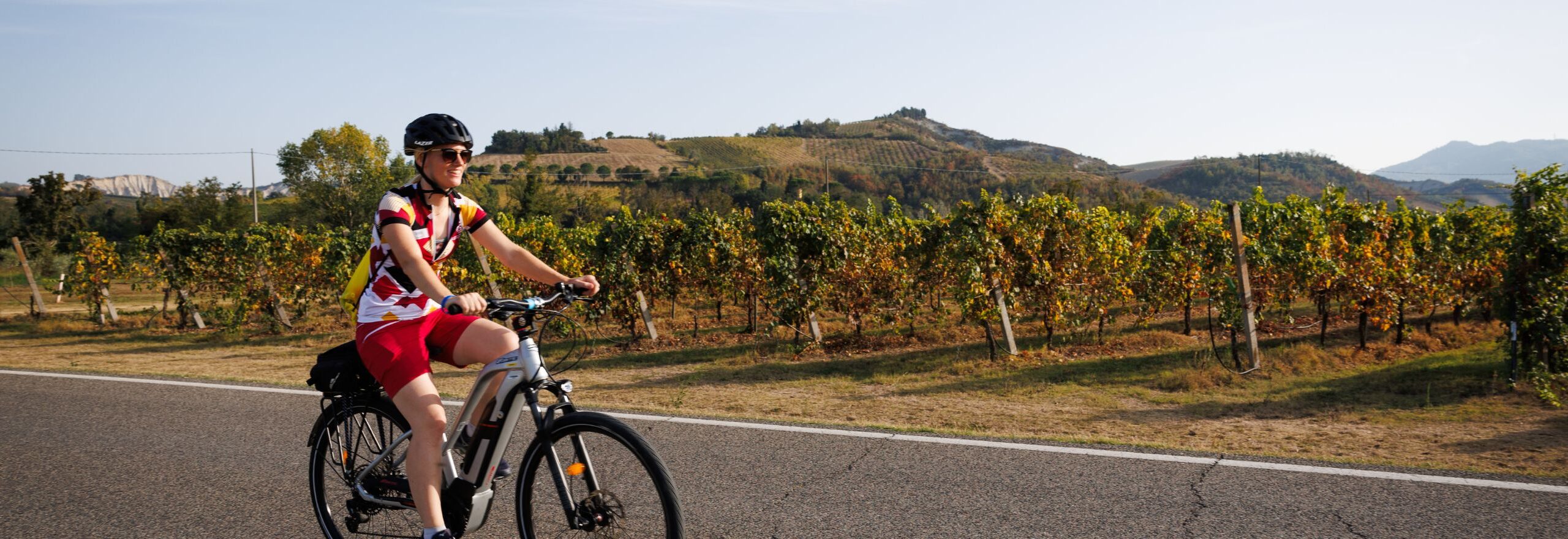Cycling through the vineyards on a self-guided cycling tour in Italy.